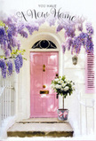 A soft, story-like moment unfolds at a Walworth front door, where a pale pink entrance glows quietly under a cascading canopy of lavender wisteria. The door, smooth and freshly painted, stands out against the textured, whitewashed wall and a subtle pastel shutter, echoing the charming splashes of colour found on side streets between Walworth Road and Old Kent Road. Overhead, the wisteria hangs in heavy, fragrant clusters, its blooms trailing down in loose, tumbling curtains that frame the doorway as if it were the entrance to a secret garden. At the foot of the door, a simple grey tin bucket rests on the stone step, brimming with an arrangement of plush white and cream roses. Some roses are fully open, revealing their layered, velvety centres, while others remain slightly cupped, full of promise. Fresh green foliage threads between the blooms, giving the bouquet a natural, just-gathered look, as if it had been carried home from a local Walworth florist. A soft pink ribbon wraps the bucket and ties in a loose, graceful bow, its colour subtly picking up the hue of the front door and lending a final touch of romance. The light slants in at an angle, as it might on a quiet evening walk towards Burgess Park, casting dappled shadows through the hanging flowers and across the step. The overall feeling is tender and expectant-a visual blessing for someone moving into a new home in SE17, capturing that mix of nerves, hope, and excitement that comes with turning the key and stepping inside for the very first time.